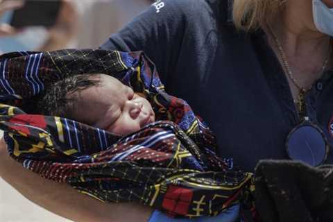 Stranded on tiny island, migrant mother gives birth