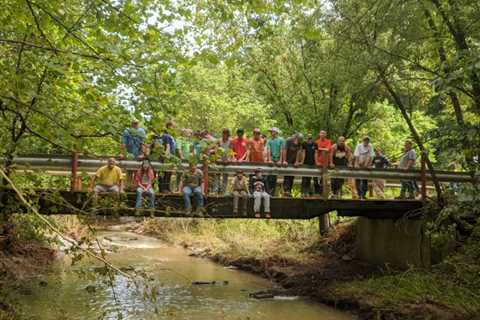 Flash floods destroyed a bridge in Indiana.  A football team rebuilt it.