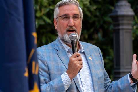 Holcomb shrugs off potential business impact of Indiana’s near-total abortion ban