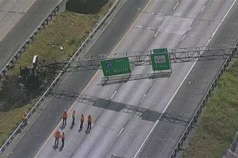 Traffic Nightmare: Car crash knocks over sign, blocking I-30