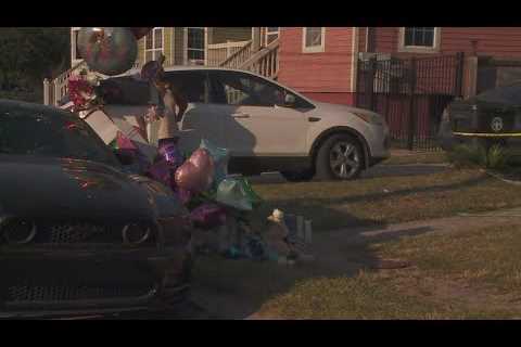 Family and community members mourn the loss of the three children killed in deadly house fire