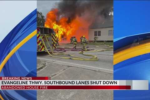 House fire on Evangeline Thruway slows down traffic